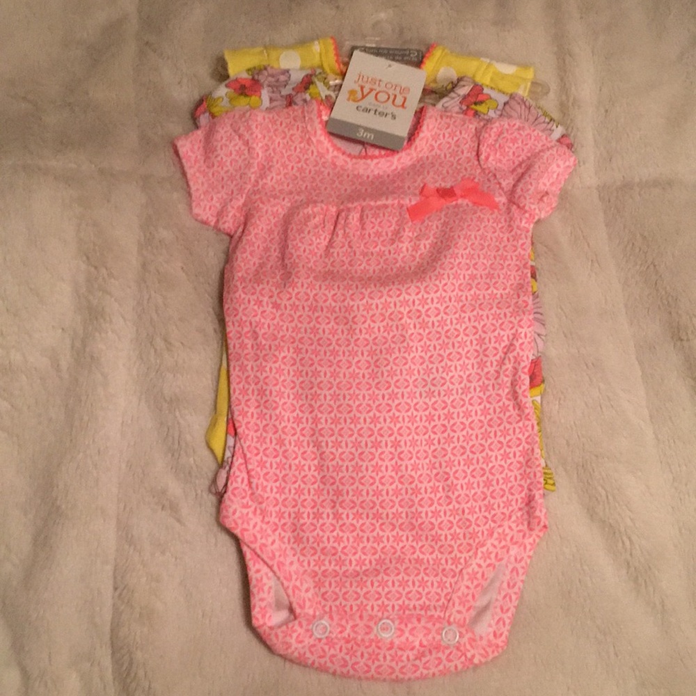 Brand new set of 3 month baby girl onesies.